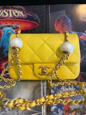 CHANEL Yellow Quilted Lambskin Mini Flap Bag with Pearl Accents